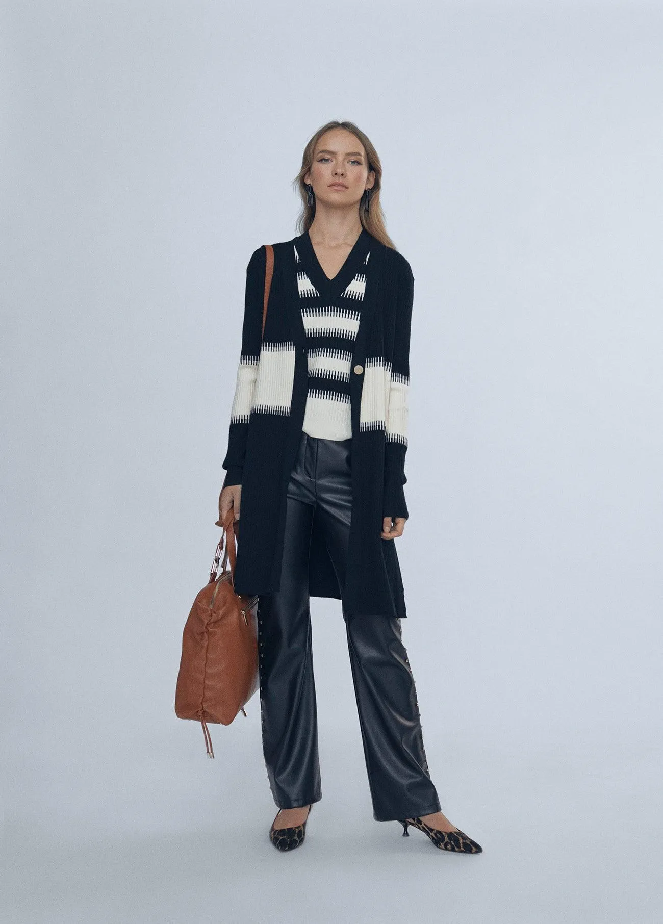Faux leather trousers with stud details
