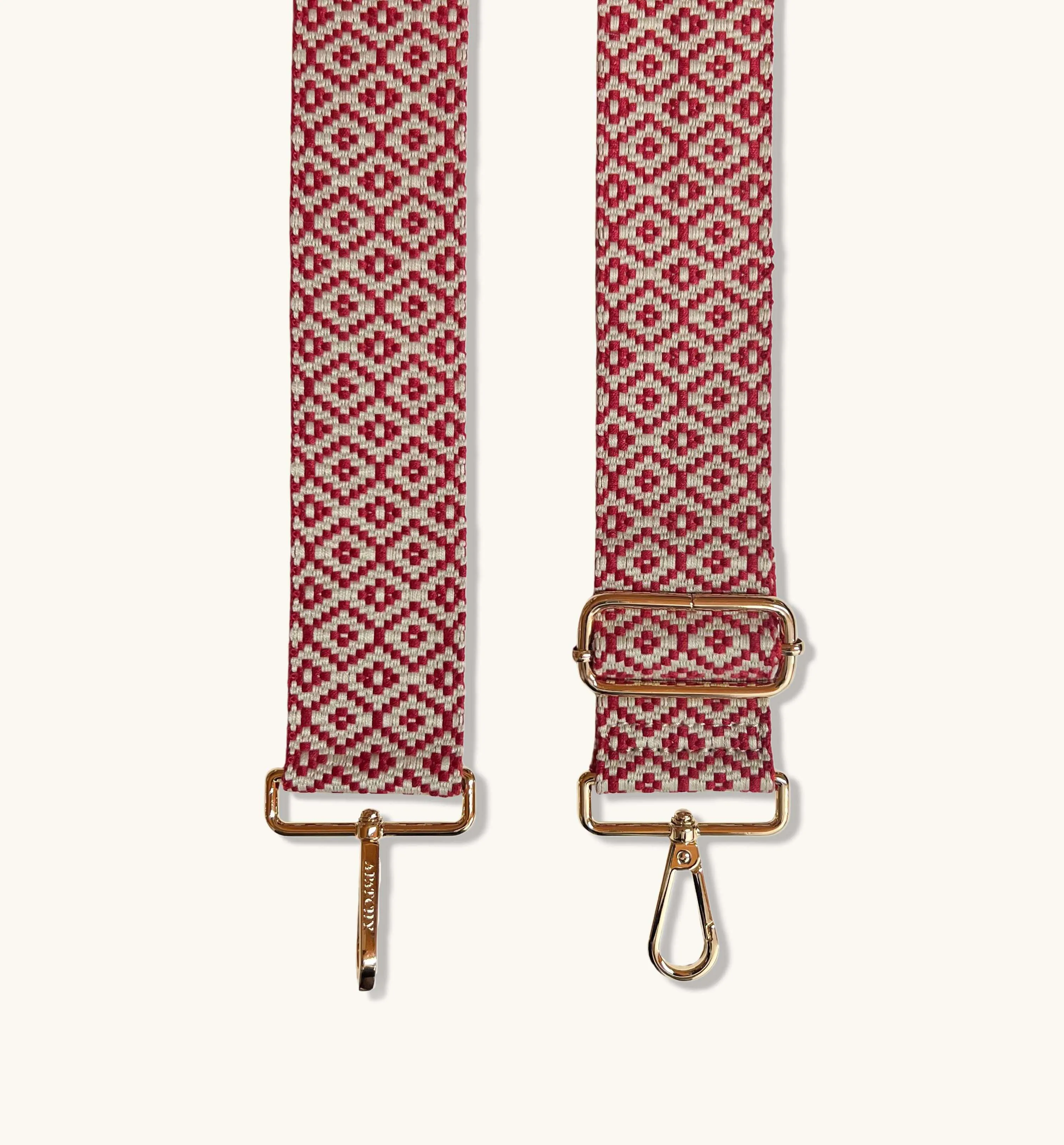 The Tassel Stone Leather Crossbody Bag With Red Cross-Stitch Strap